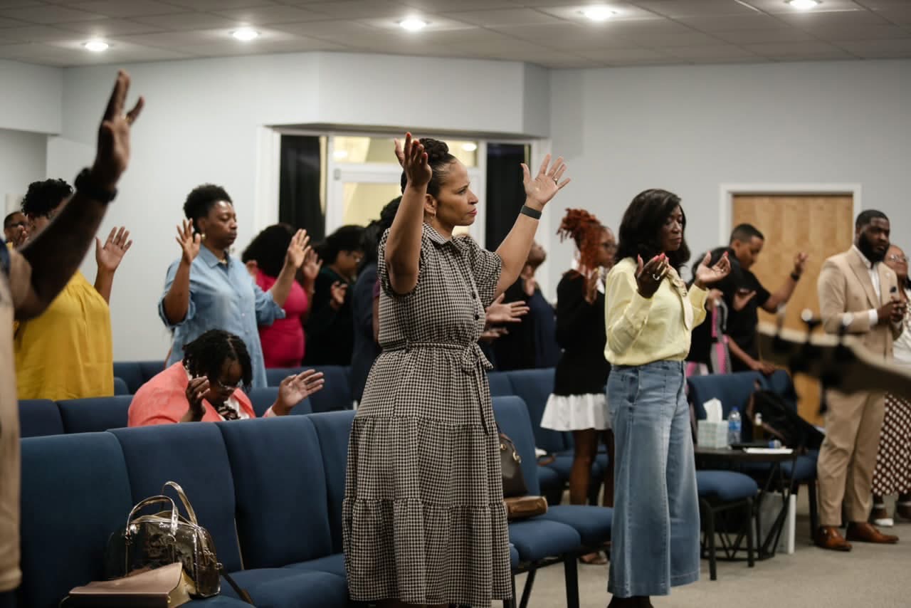 Congregation worshipping with raised hands