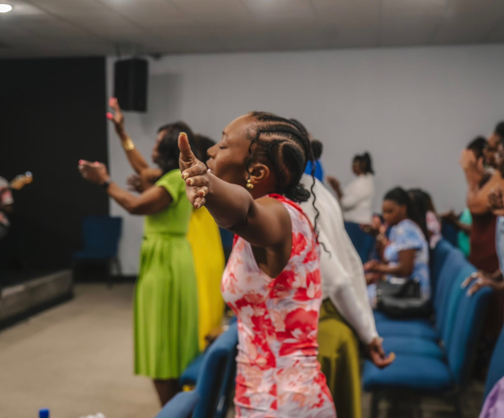Woman worshipping with outstretched hands