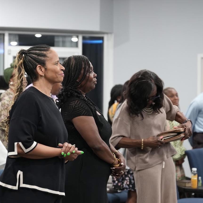 Women standing in worship