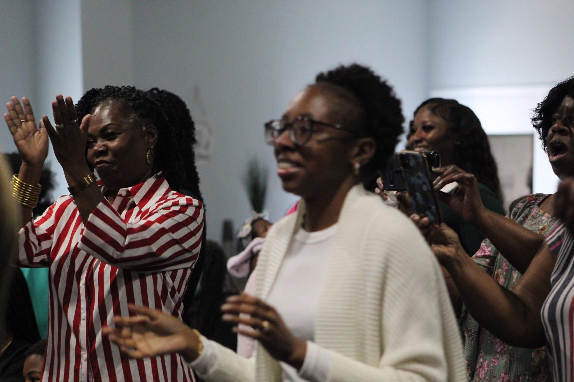Members clapping in praise