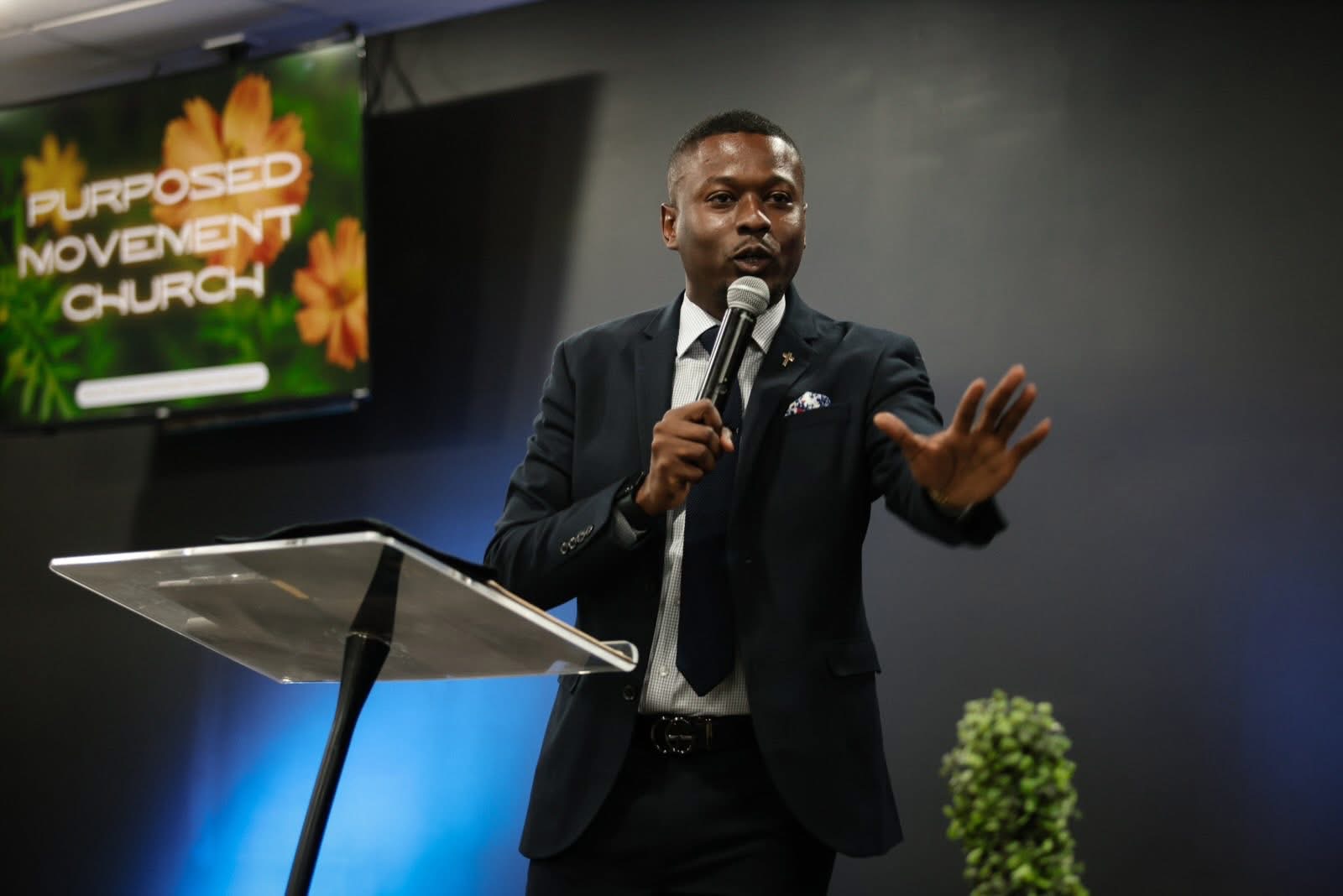 Pastor Marty Mayes preaching at the pulpit